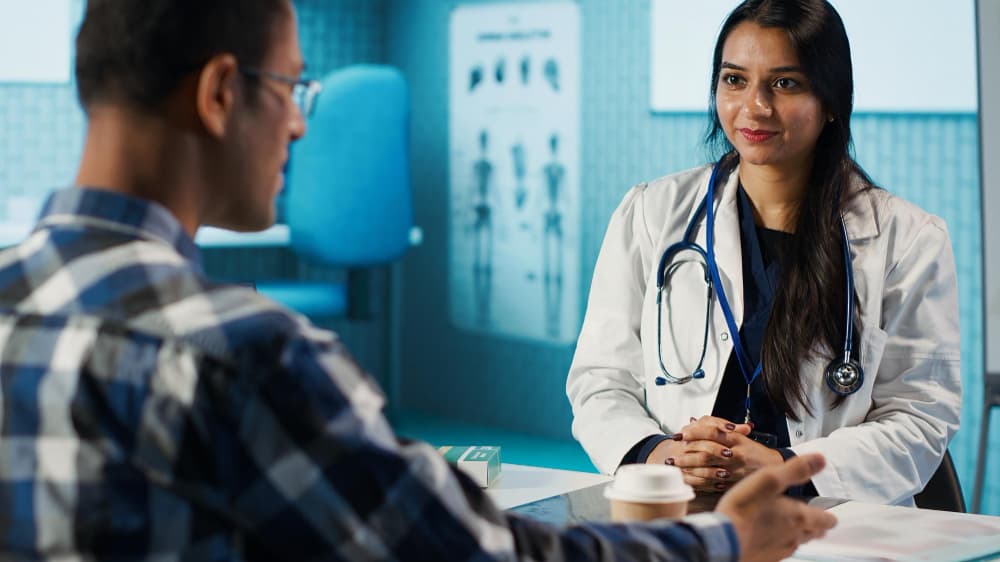 Man discussing fertility test results with a doctor